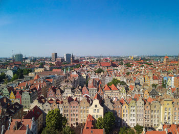 High angle view of townscape against clear blue sky