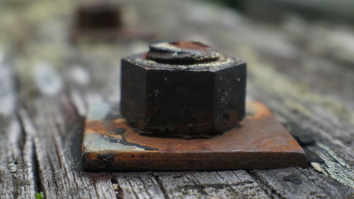 Close-up of rusty metal on table