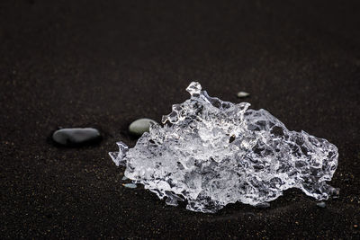 Close-up of ice cream on sand