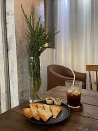 Potted plant on table at home