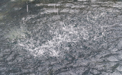 Full frame shot of water flowing through rocks