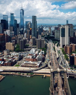 Aerial view of modern buildings in city against sky