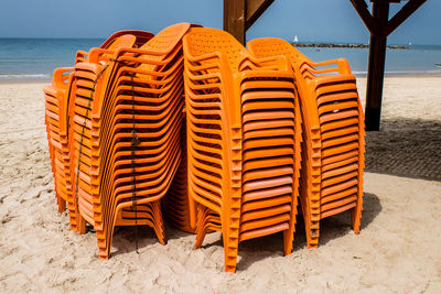 Empty chairs on beach