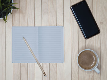 High angle view of coffee cup on table