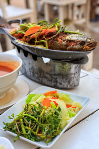 Close-up of salad served on table