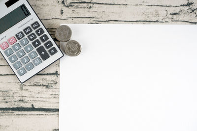 High angle view of coins on table