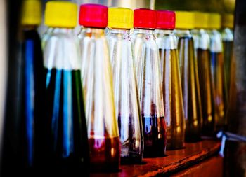 Close-up of bottles at market stall