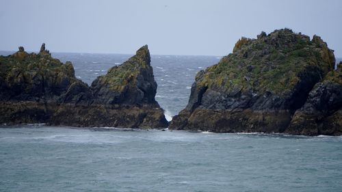 Scenic view of sea and rock formation