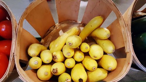 High angle view of zucchinis in basket at market