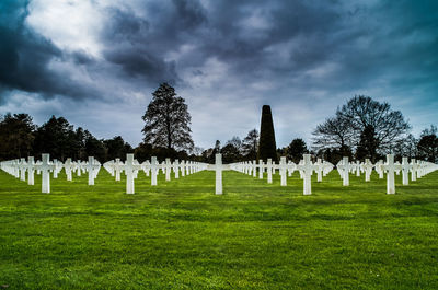 View of cemetery against cloudy sky