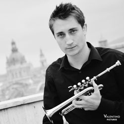 Portrait of young man playing guitar