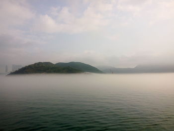 Scenic view of sea against cloudy sky