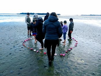 People standing on beach