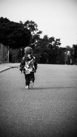 Little boy walking outdoors