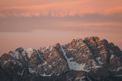 Rock formations against sky during sunset