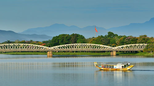 Bridge over river against clear sky