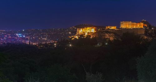 Illuminated buildings in city at night