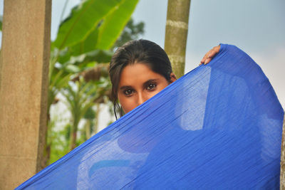 Portrait of young woman outdoors