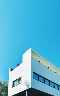 Low angle view of building against clear blue sky