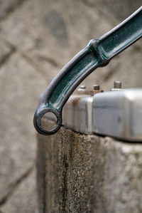 Close-up of faucet against wall