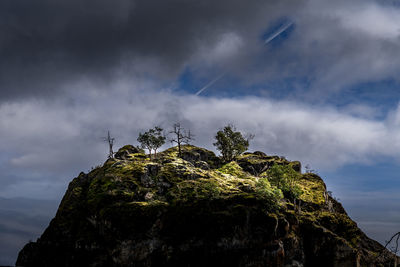 Low angle view of rock formation against sky