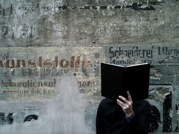 Woman standing on wall