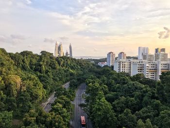 High angle view of trees and buildings against sky