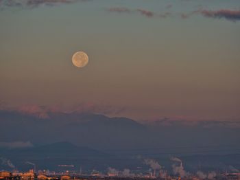 Scenic view of moon at sunset