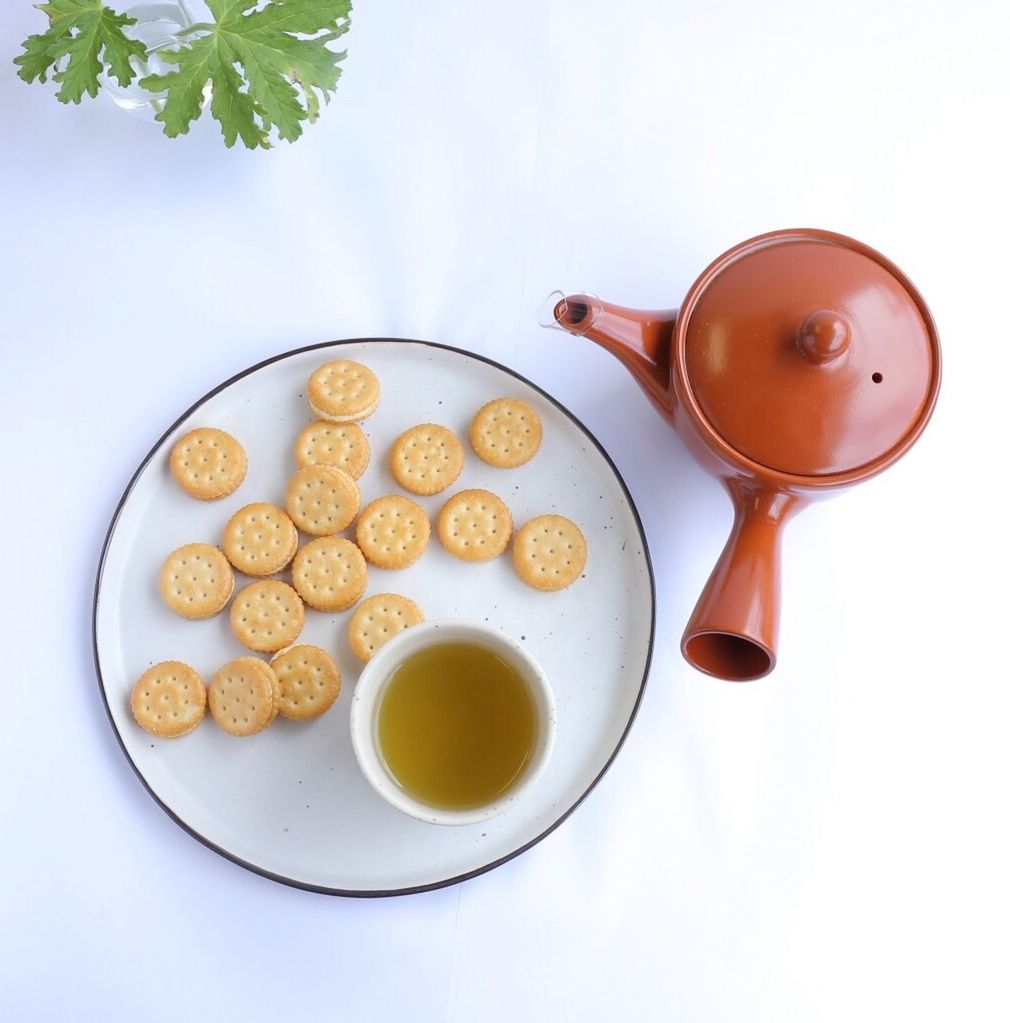 food and drink, freshness, still life, drink, food, coffee cup, refreshment, indoors, white background, table, studio shot, coffee - drink, directly above, healthy eating, high angle view, saucer, cup, close-up, ready-to-eat, plate