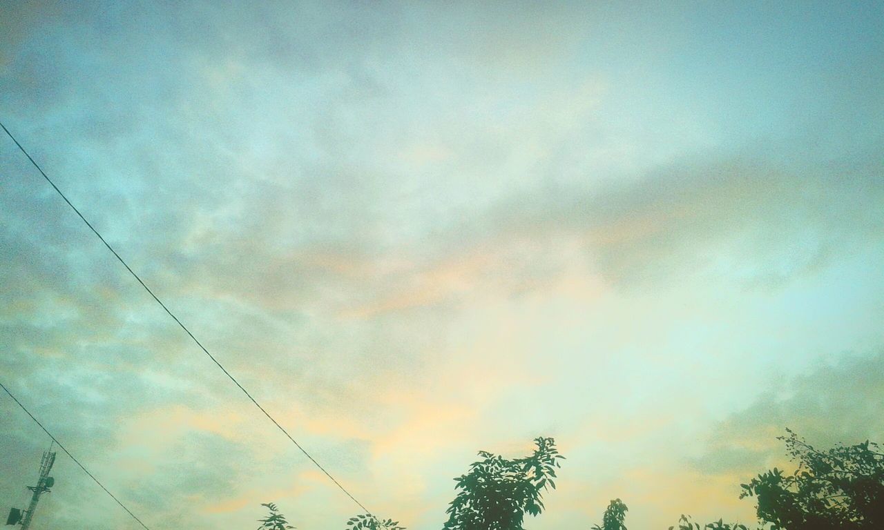 low angle view, sky, power line, cloud - sky, electricity pylon, cloudy, power supply, silhouette, electricity, sunset, cable, connection, beauty in nature, tranquility, scenics, nature, cloud, tranquil scene, dusk, weather