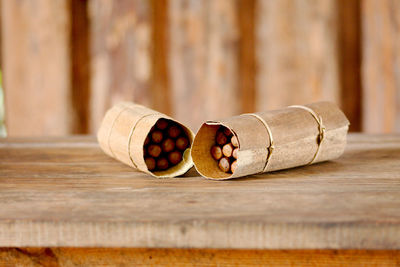 Handmade cuban cigars wrapped in leaves and tied with string.