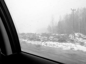 View of snow covered car window