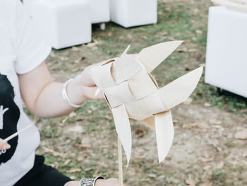 Midsection of woman holding craft product