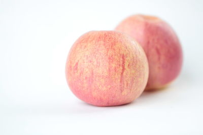 Close-up of fruits against white background