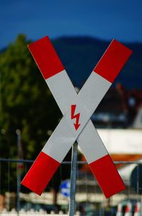 Close-up of red flags against the sky