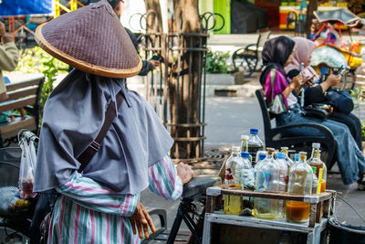 Rear view of people on street