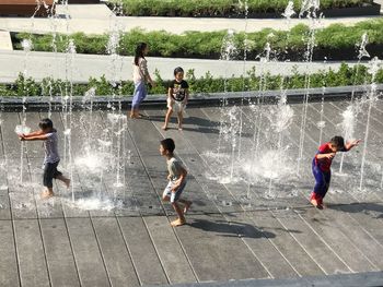 High angle view of children playing in water