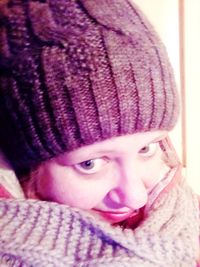 Close-up portrait of woman wearing hat