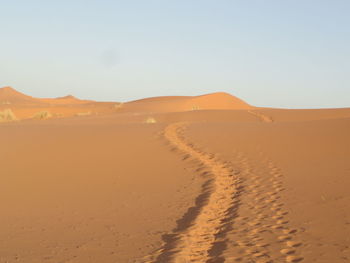 Scenic view of desert against clear sky