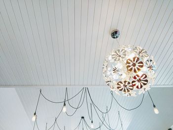 Low angle view of pendant lights hanging from ceiling