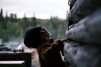 Close-up of child profile against blurred background