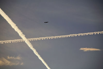 Low angle view of airplane flying in sky