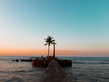 Scenic view of sea against sky at sunset