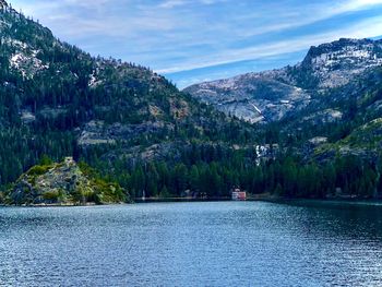 Scenic view of lake and mountains against sky