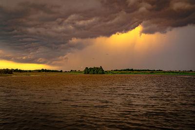 Scenic view of dramatic sky during sunset