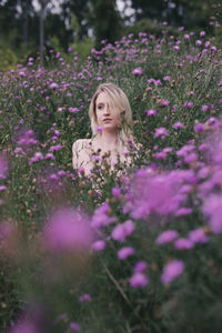 Portrait of woman with purple flowers