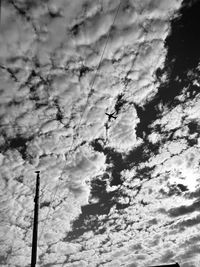 Low angle view of silhouette tree against sky