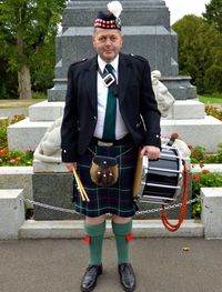 Portrait of drummer standing outdoors