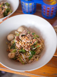 Thai noodle beef is very delicious on wood table