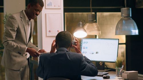 Rear view of man working in office